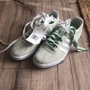 Adidas women mint green tennis shoes.